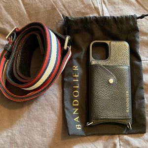 iPhone 11 Pro Bandolier in black pebbled leather with red, white, and navy strap
